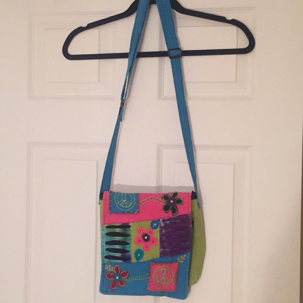 NWOT crossbody w/ laser cuts, appliqués & crystals